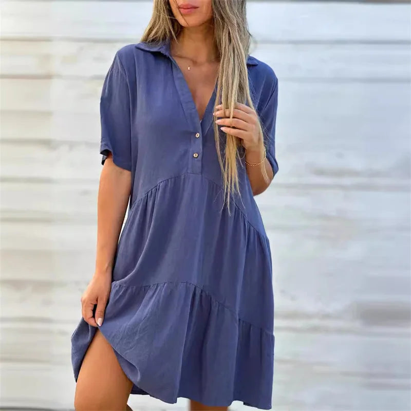 Céline | Zomerse A-lijn jurk met knoopdetail en soepele plooien
