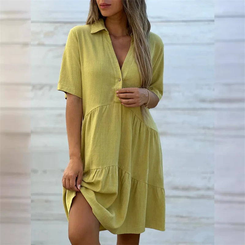 Céline | Zomerse A-lijn jurk met knoopdetail en soepele plooien