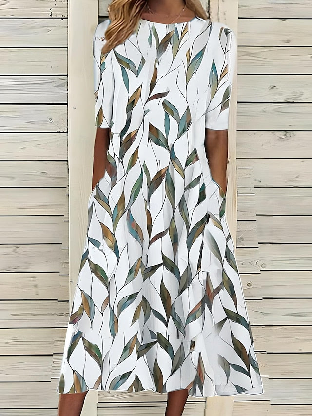 Céleste | Midi-zomerjurk met kustbloemen en ronde hals
